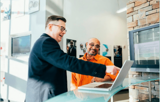  A salesperson works to finish a deal with a customer at the bottom of the funnel