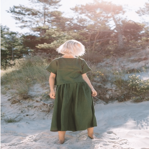 Comfortable beige linen pants with soft breathable fabric, shown in a casual summer outfit