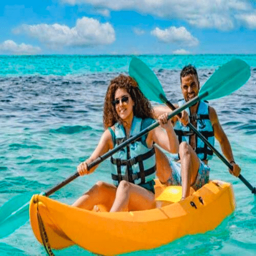 Visitors enjoying swim with dolphins experience at Dolphin Discovery Isla Mujeres, Mexico